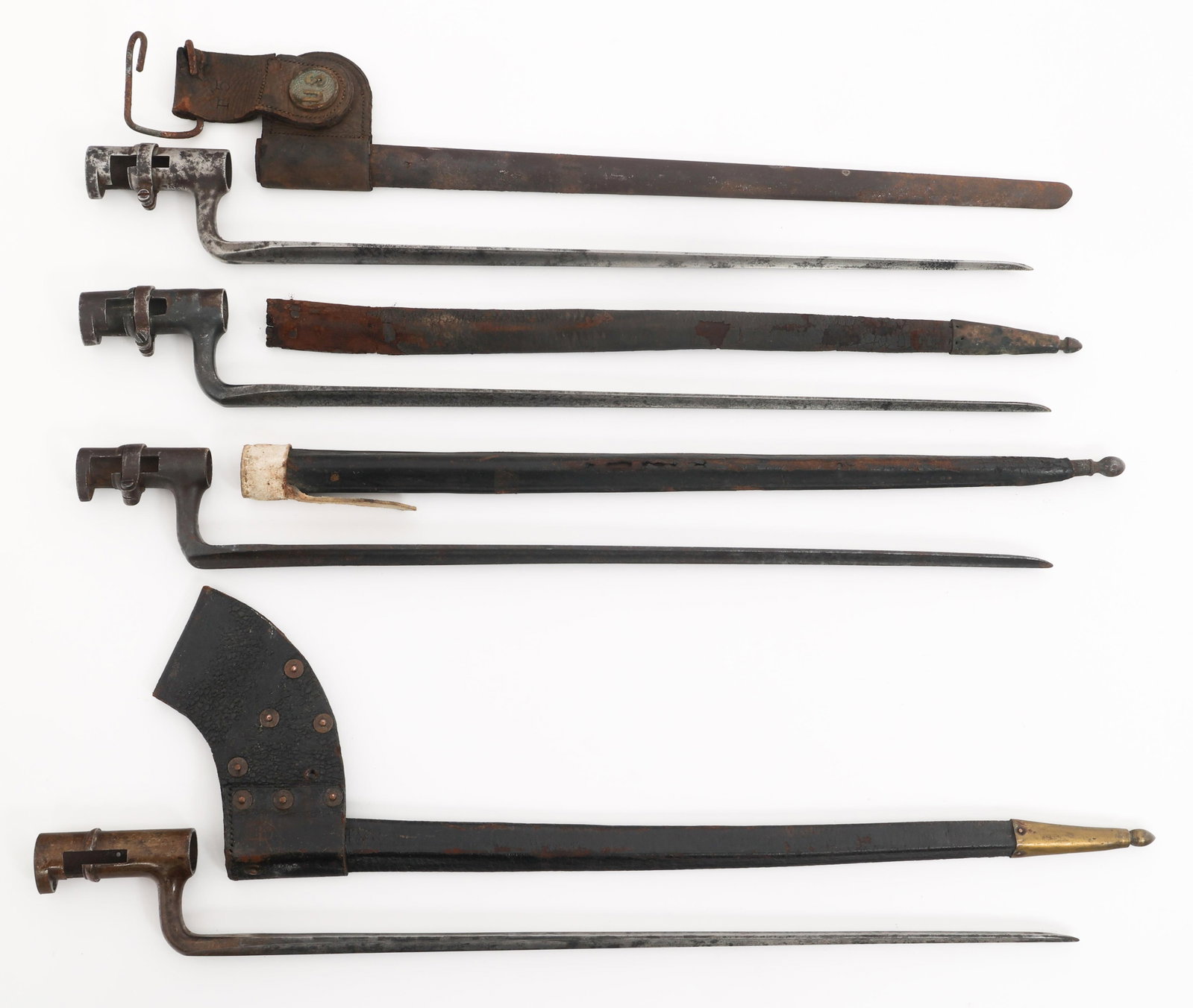 19th C. US ARMY SOCKET BAYONETS & SCABBARDS: 19th C. US ARMY SOCKET BAYONETS & SCABBARDS 19th C. US Army Socket Bayonets. All but one have US stamped on the ricasso. Steel and leather scabbards with brass fittings. Blade Length: 17 1/2" to 18" T