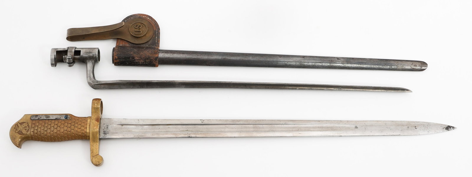 INDIAN WARS M1870 ROLLING BLOCK & SOCKET BAYONETS: INDIAN WARS M1870 ROLLING BLOCK & SOCKET BAYONETS Indian Wars US M1870 Rolling Block and Unmarked Socket Bayonet. (1) USN M1870 Rolling Block Bayonet. Maker marked by Ames on the ricasso, U.S.N. GGS 1