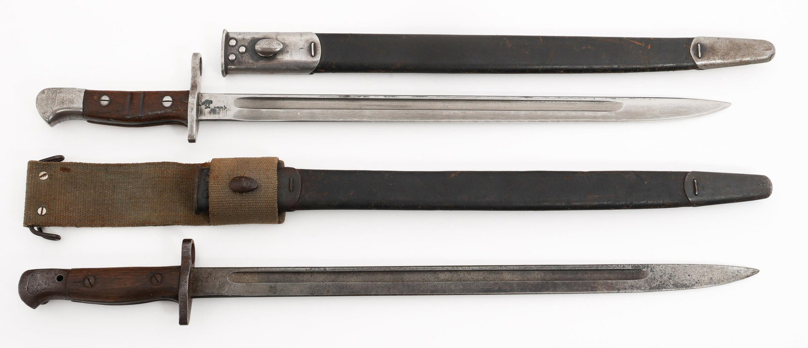 REARSENALED US M1917 & UK P1907 BAYONETS: REARSENALED US M1917 & UK P1907 BAYONETS Rearsenaled US M1917 & UK P1907 Bayonets. (1) US M1917. Maker marked by Remington. Rearsenaled proof stamps. Steel hilt with wood grips. Leather scabbard with 