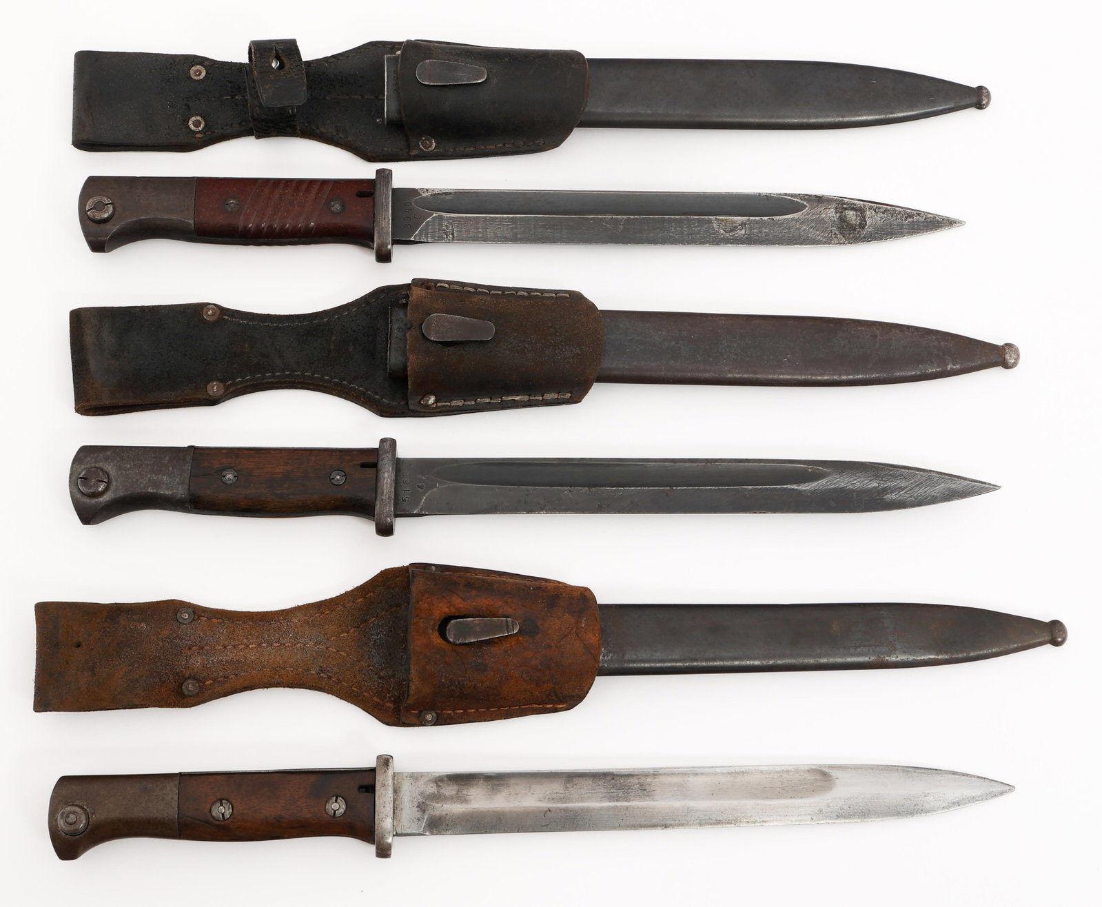 WWI - WWII GERMAN K98 COMBAT BAYONETS: WWI - WWII GERMAN K98 COMBAT BAYONETS WWI - WWII German K98 Combat Bayonets. (1) Single edged blade with fuller. Maker marked by Gebruder Heller, Marienthal on the ricasso and royal cypher over 17 on 