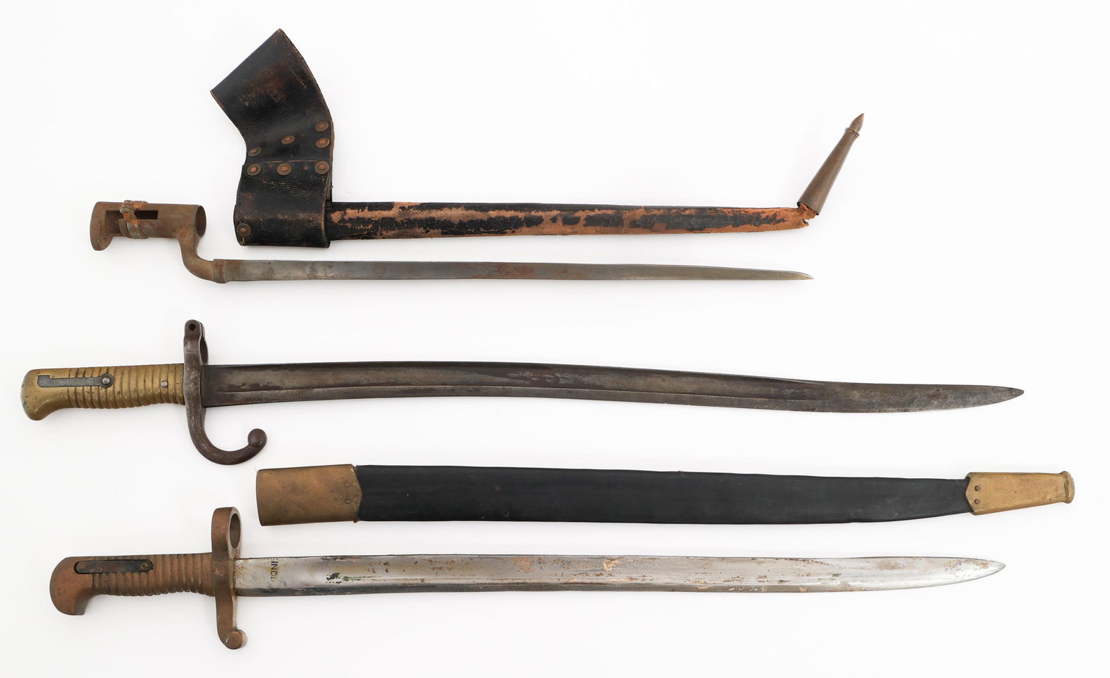 FRENCH M1866 & REENACTOR BAYONETS: FRENCH M1866 & REENACTOR BAYONETS French M1866 & Indian Made Reenactor Bayonets. (1) French M1866. Single edged yataghan blade with fuller. Maker mark and date on the spine, but illegible. proof marks