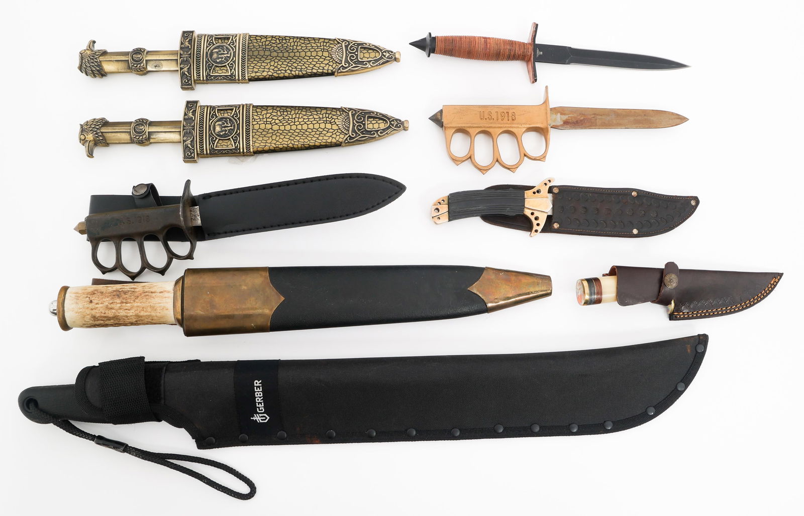 REENACTOR V42, TRENCH KNIVES & GERBER MACHETES: REENACTOR V42, TRENCH KNIVES & GERBER MACHETES Modern Copies of FSSF V42, Trench Knives and Gerber Machetes. Includes V42, Trench knives, Indo-Persian daggers, and Modern Production Gerber Machete. An