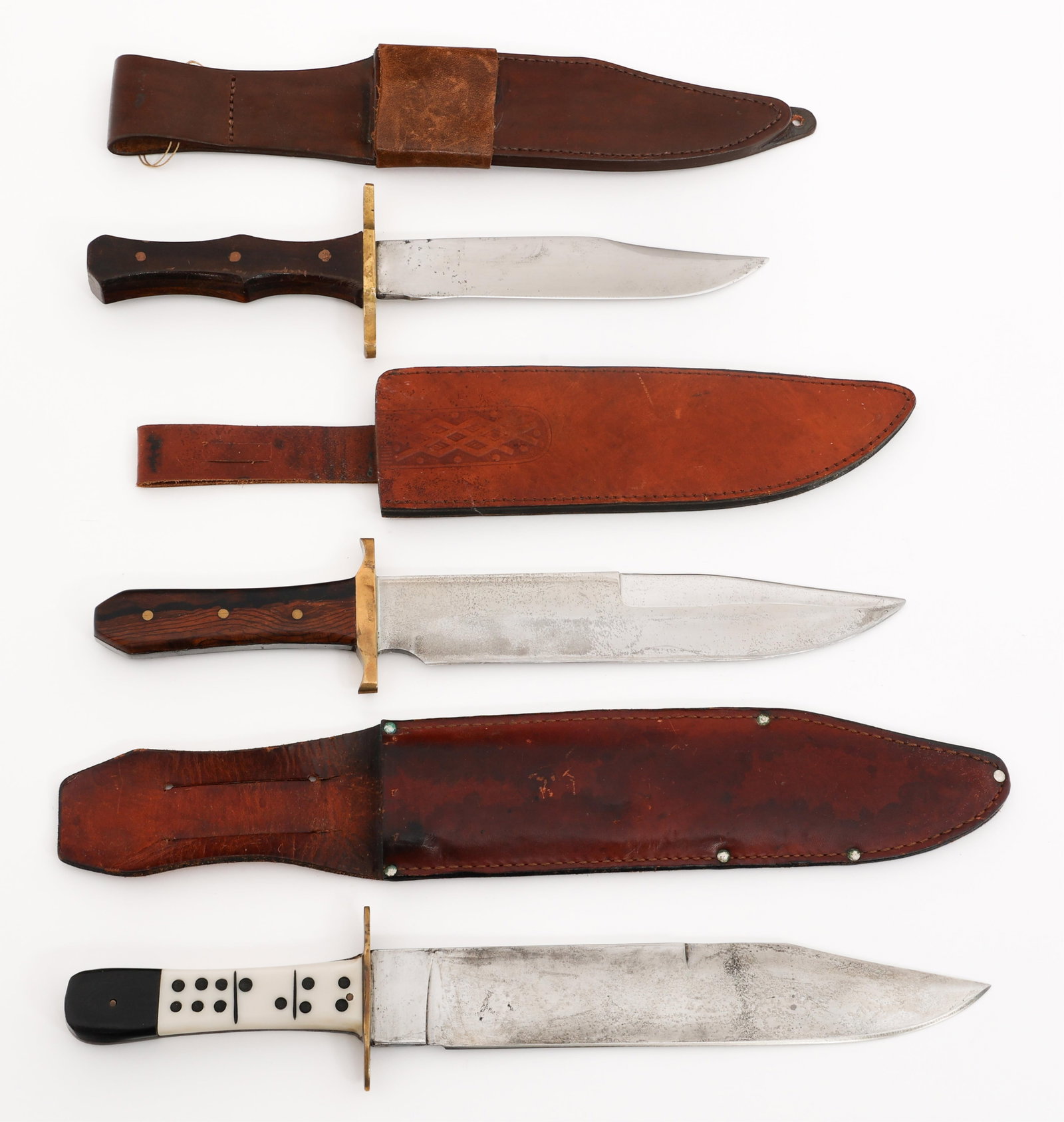 BOWIE KNIVES WITH LEATHER SHEATHS: BOWIE KNIVES WITH LEATHER SHEATHS Civilian Bowie Knives with Leather Sheaths. (1) Domino Handle Bowie. Single edged, bright blade with no visible maker marks. Brass crossguard, plastic grip with domin