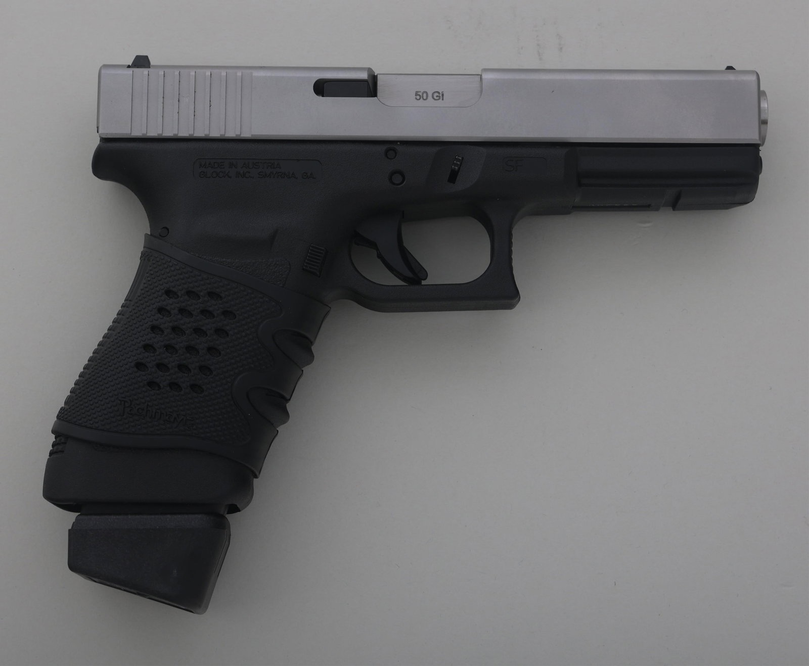 GLOCK MODEL 21 .45 ACP CALIBER PISTOL: GLOCK MODEL 21 .45 ACP CALIBER PISTOL Glock Model 21 .45 ACP caliber semi automatic pistol. Fixed sights. Pachmayr grip wrap. Guncrafters Industries 50 GI conversion kit. One magazine. Caliber / Gauge