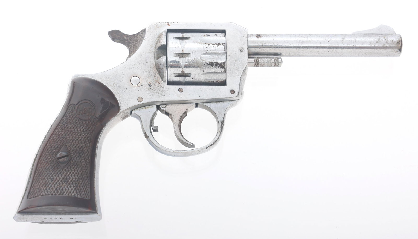 HARRINGTON & RICHARDSON MODEL 923 .22 CAL REVOLVER: HARRINGTON & RICHARDSON MODEL 923 .22 CAL REVOLVER Harrington & Richardson Model 923 .22 caliber double action revolver. Nickel plated. Fixed sights. Nine shot fluted cylinder. Checkered composite H&R