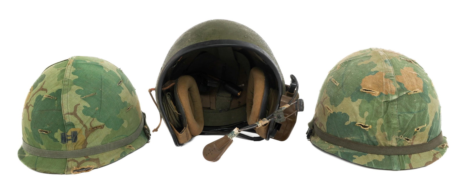 VIETNAM WAR US ARMY M1 & CVC T56-6 TANKER HELMETS: VIETNAM WAR US ARMY M1 & CVC T56-6 TANKER HELMETS Vietnam War US Army M1 and CVC T56-6 Tanker Helmets. (2) M1 Helmets. Mitchell camo covers. 1964 pattern parachutist liner with missing sweatbands. (1)