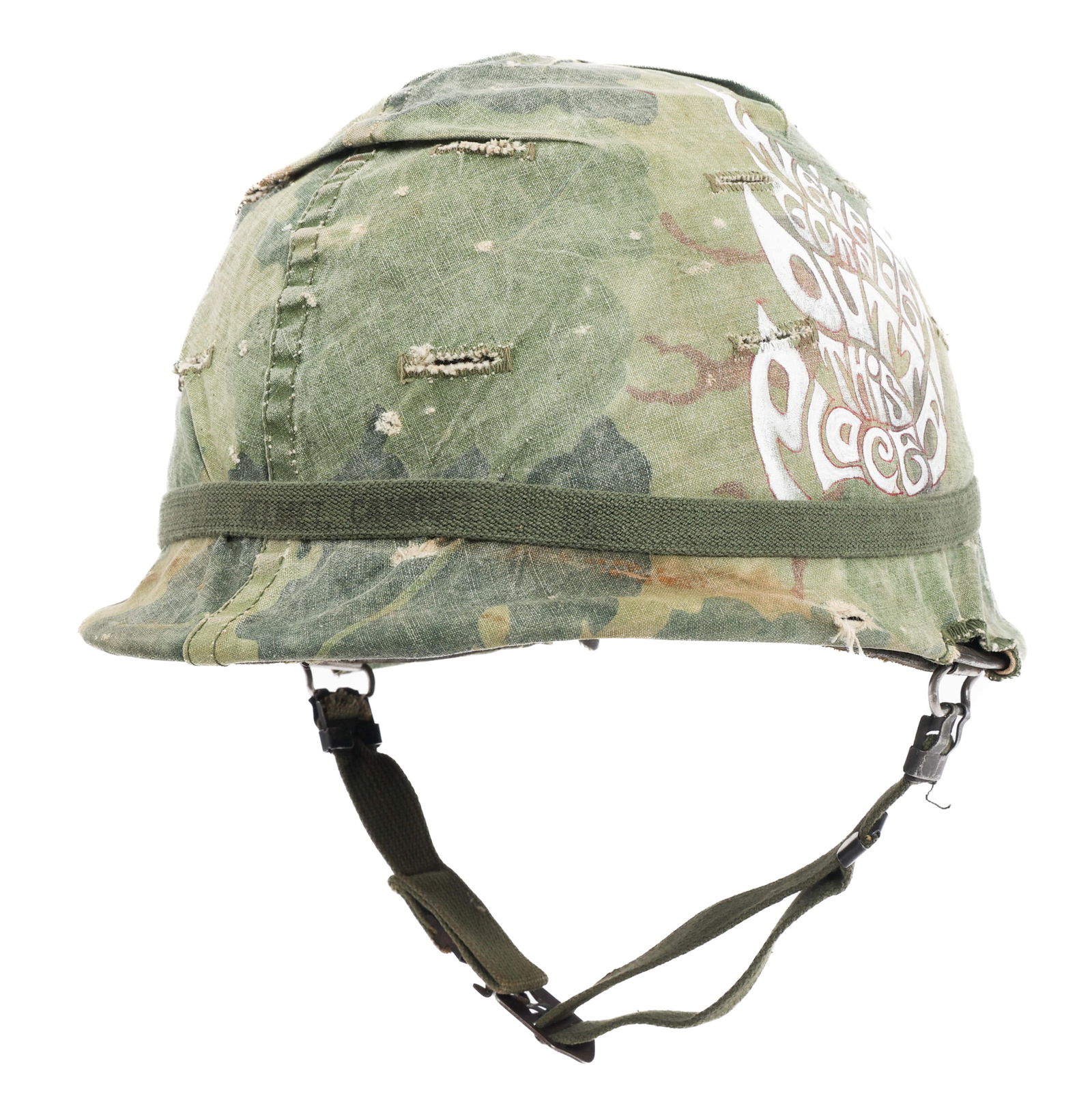 VIETNAM WAR US ARMY M1 HELMET WITH GRAFFITI: VIETNAM WAR US ARMY M1 HELMET WITH GRAFFITI Vietnam War US M1 Helmet with Liner. Rear seam, swivel bale shell with chinstrap. Mitchell camouflage cover and elastic band with Graffiti artwork. Complete