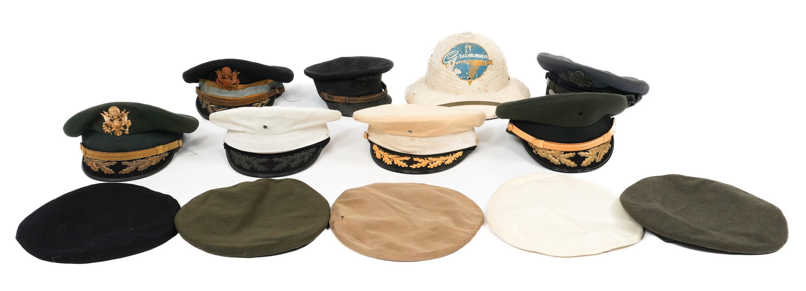 COLD WAR US ARMED FORCES HEADGEAR: COLD WAR US ARMED FORCES HEADGEAR Cold War US Armed Forces Headgear. Includes pith helmet, visor caps and berets. Insignia present on some. Various sizes. Provenance: Lifetime Military Memorabilia & A