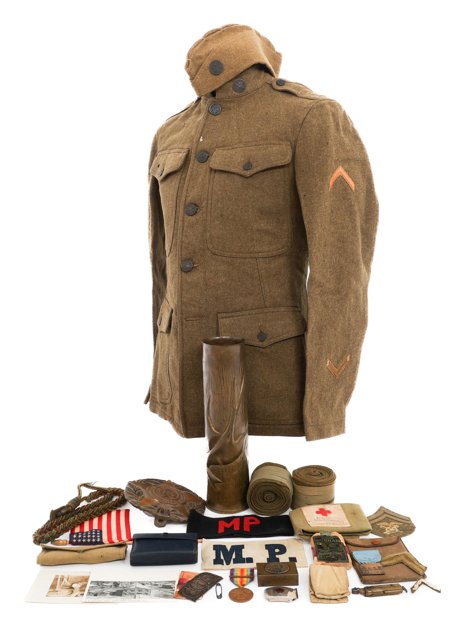 WWI US ARMY MILITARY POLICE GROUPING & TUNIC: WWI US ARMY MILITARY POLICE GROUPING & TUNIC WWI US Army Military Police Grouping and Tunic. Includes MP armbands, WWI brass plaque, WWI Victory medal, postcards, rank patches, M1917 Tunic with garris
