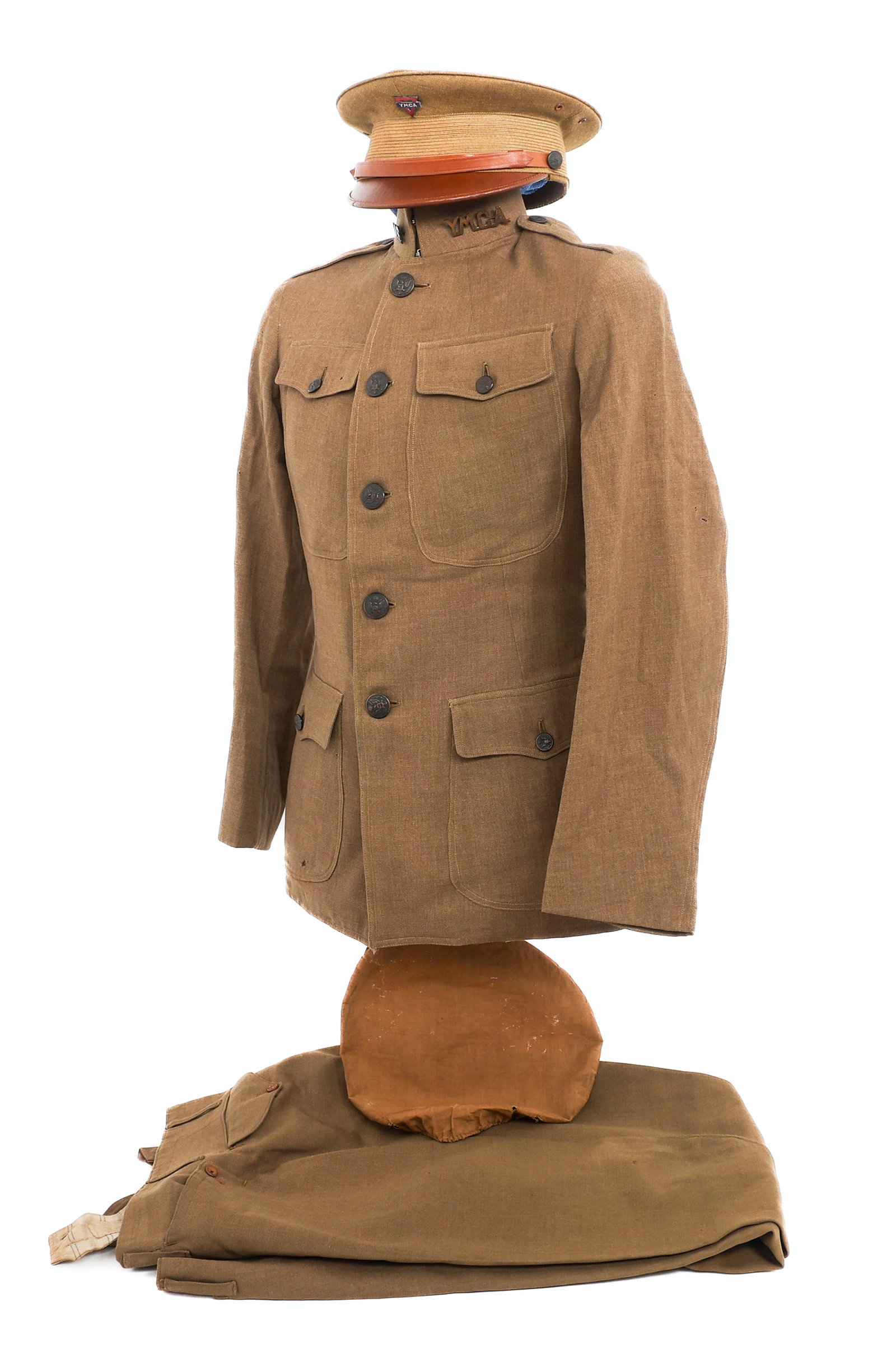 WWI US ARMY AEF YMCA UNIFORM SET: WWI US ARMY AEF YMCA UNIFORM SET WWI US YMCA Uniform Set. (1) Private Purchase Wool Service Tunic with YMCA collar badges, wool sleeve patch, and US eagle buttons. No visible maker marks or tags. (1)