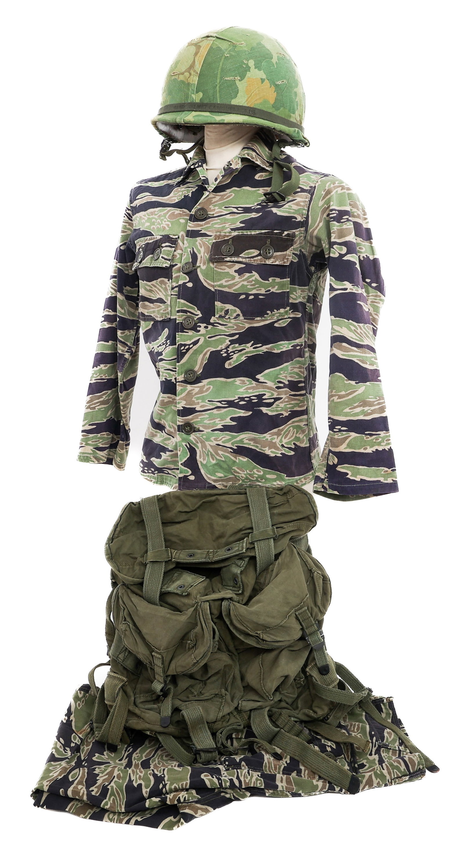 VIETNAM WAR ARVN TIGER STRIPE UNIFORM & RUCKSACK: VIETNAM WAR ARVN TIGER STRIPE UNIFORM & RUCKSACK Vietnam War ARVN Tiger Stripe Combat Uniform, Ranger Rucksack, & M1 Helmet. (1) Late War Light Weight Dense Tiger Stripe Camouflage Jacket. Two exposed