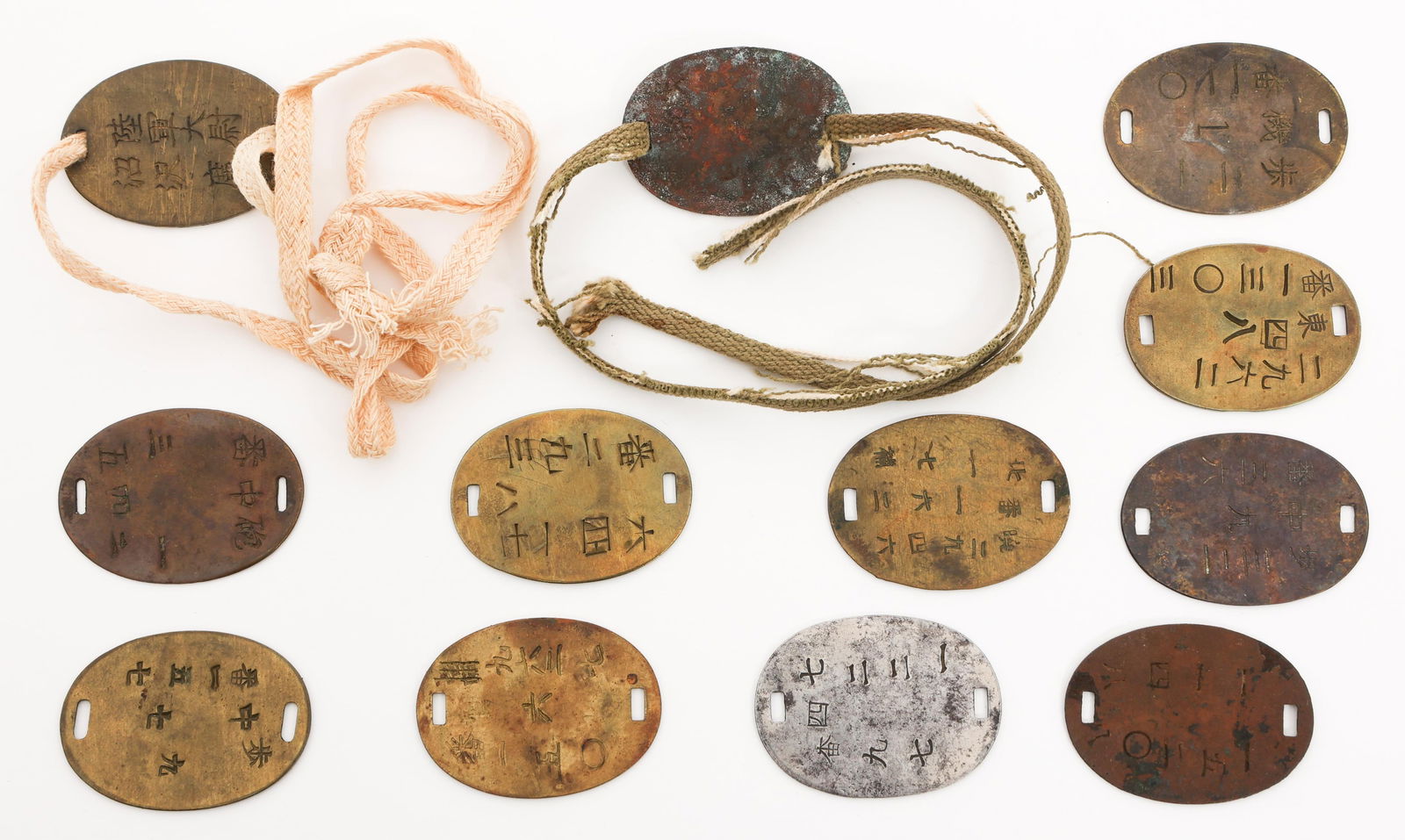 WWI - WWII IMPERIAL JAPANESE ARMY DOG TAGS: WWI - WWII IMPERIAL JAPANESE ARMY DOG TAGS WWI - WWII Imperial Japanese Army Dog Tags. Brass, copper, and steel construction. Two have neck cords.