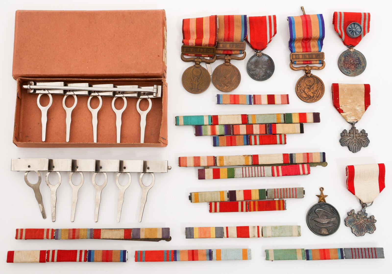WWII IMPERIAL JAPANESE ORDERS & MEDALS: WWII IMPERIAL JAPANESE ORDERS & MEDALS WWII Imperial Japanese Orders & Medals. Includes Order of the Rising Sun 7th Class, China Incident War Medal, Manchurian Incident War Medal, ribbon bars, and mor