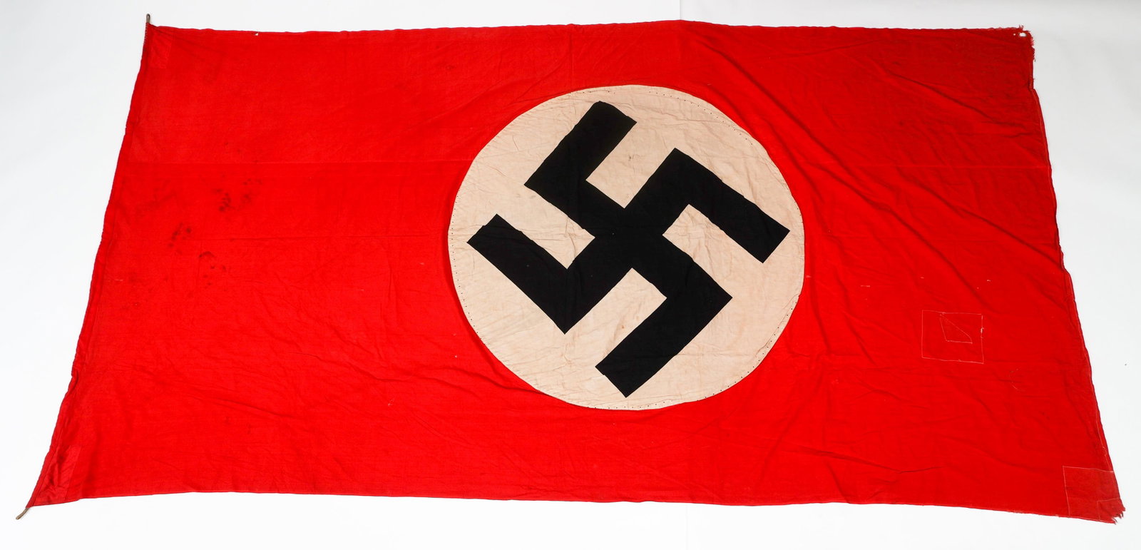 WWII GERMAN NSDAP BANNER: WWII GERMAN NSDAP BANNER WWII German NSDAP Banner. Double sided, multi-piece cotton construction with printed emblem. No visible marks or stamps. Size: 129" x 67"
