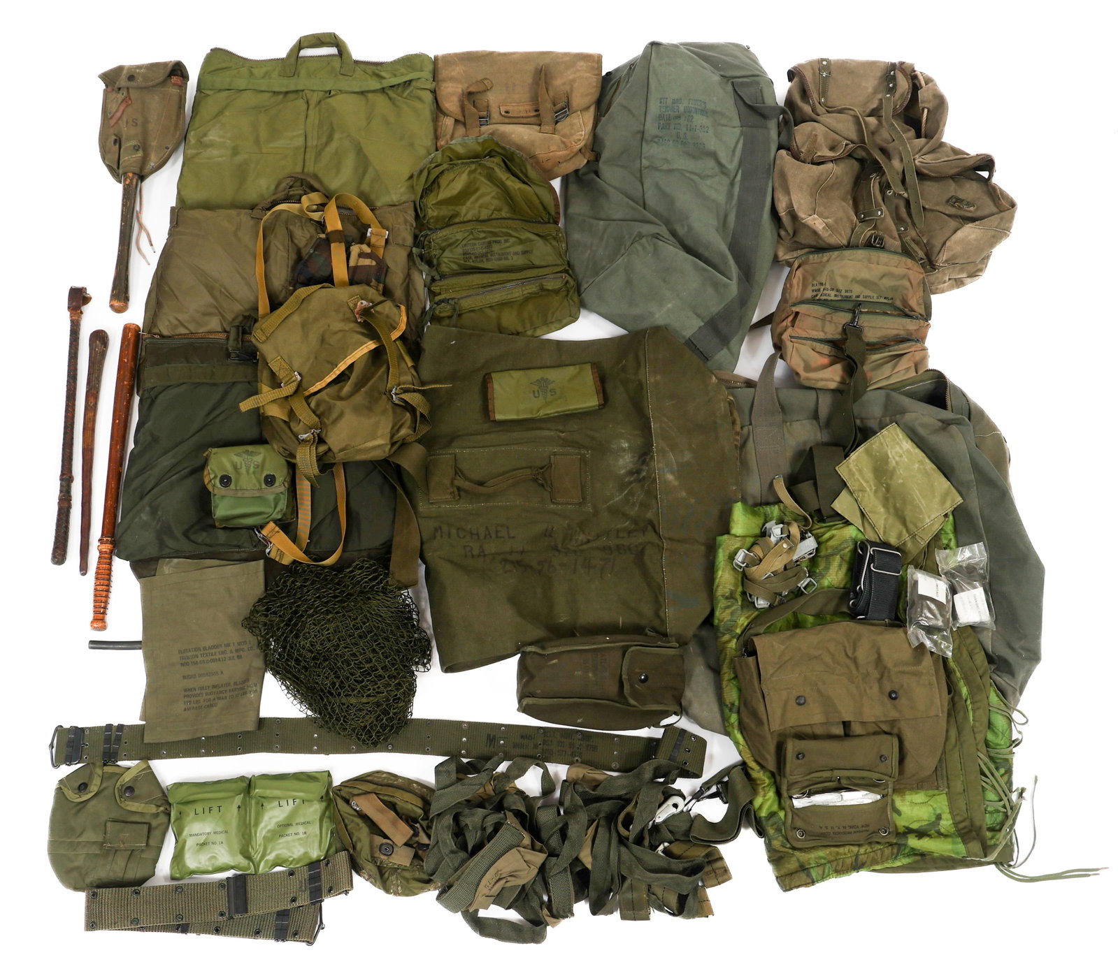 VIETNAM WAR - 1980s US NAVY SEAL FIELD GEAR: VIETNAM WAR - 1980s US NAVY SEAL FIELD GEAR 1970's - 1980's US Navy SEAL Uniform & Field Gear. Attributed to Michael Quinten Whitely. Includes medic pouches, folding shovel, pistol belt, field packs, 