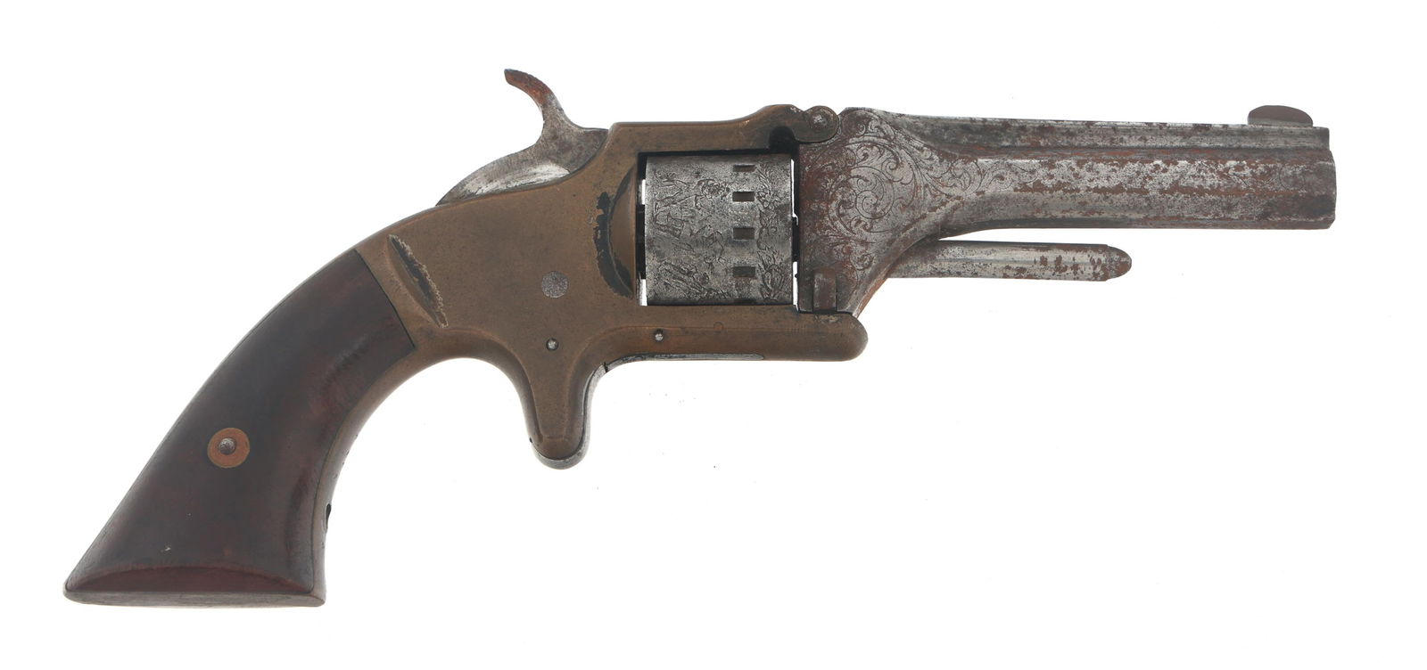 MANHATTAN FIREARMS CO FIRST MODEL .22 CAL REVOLVER: MANHATTAN FIREARMS CO FIRST MODEL .22 CAL REVOLVER Manhattan Firearms Co. First Model .22 caliber single action tip up revolver. Engraved octagonal barrel. Brass frame. Wood grips. Seven shot smooth c