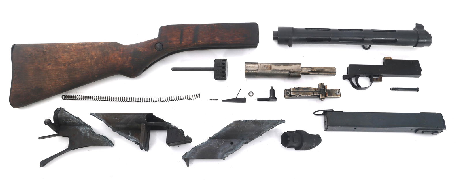 FINNISH KP-31 CALIBER MACHINE GUN PARTS KIT: FINNISH KP-31 CALIBER MACHINE GUN PARTS KIT Finnish KP-31 9x19mm caliber machine gun parts kit. Cut receiver sections. Charging handle cut through. Bolt, trigger assembly, recoil assembly. Barrel and
