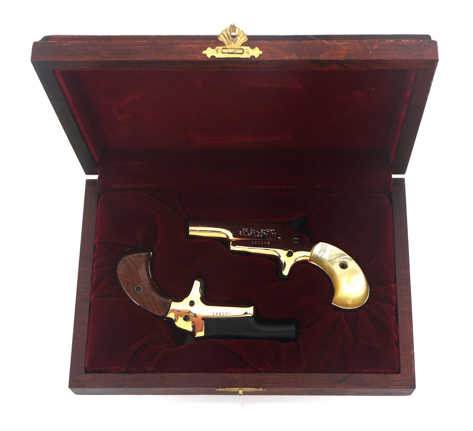 BUTLER BARON & BARONESS .22 S CAL DERRINGERS: BUTLER BARON & BARONESS .22 S CAL DERRINGERS Butler Mfg Inc. Baron and Baroness consecutively numbered .22 Short caliber derringers. Butler stamped on top of both barrels. A) Baron: Blued finish on ba