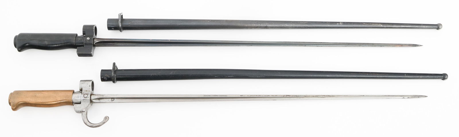 FRENCH M1886 LEBEL BAYONETS & SCABBARDS: FRENCH M1886 LEBEL BAYONETS & SCABBARDS French M1886 Lebel Bayonets. (1) M1886. Cruciform blade. Steel guard. Hooked quillon with serial number and proof marks. Brass grip. Steel scabbard. (1) M1886/9