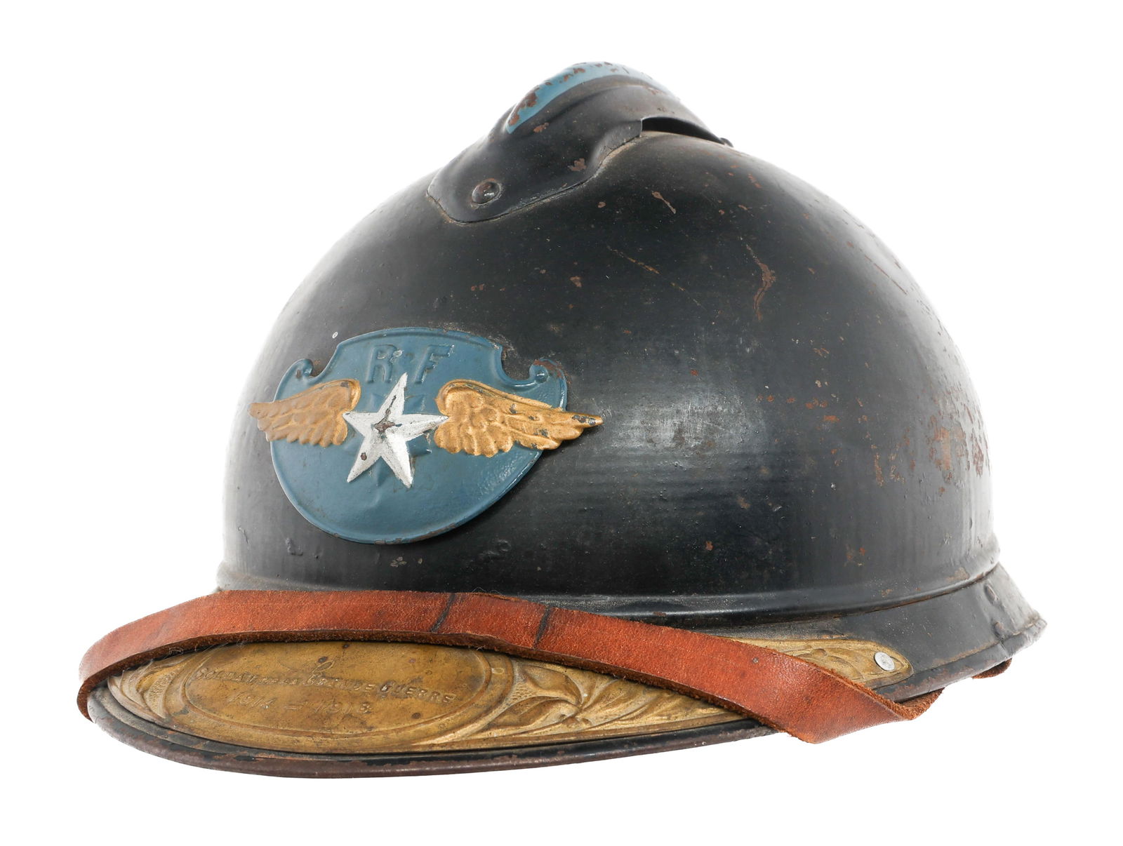 1920s FRENCH AIR FORCE M15 HELMET WITH VET PLAQUE: 1920s FRENCH AIR FORCE M15 HELMET WITH VET PLAQUE 1920s French Air Force M15 Adrian Helmet. Dark horizon blue painted shell. Frontal 1920s Air Force insignia. 1914 - 1918 brass veteran visor plaque. L