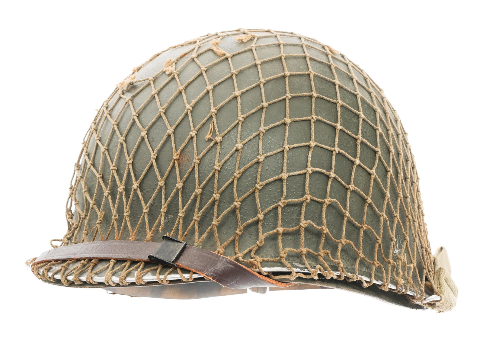 WWII US ARMY M1 COMBAT HELMET WITH CAPAC LINER: WWII US ARMY M1 COMBAT HELMET WITH CAPAC LINER WWII US Army M1 Combat Helmet. Front seam, swivel bale with OD3 chinstrap and camouflage netting. No visible lot number on the interior. CAPAC liner with