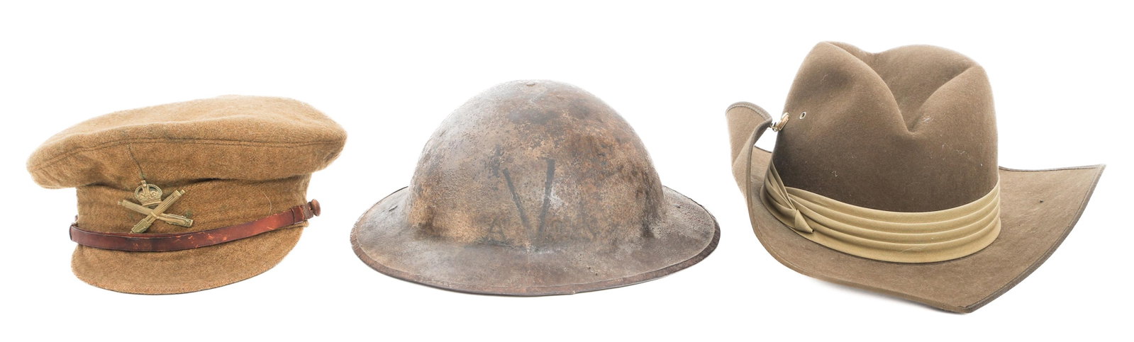 WWI - WWII BRITISH & AUSTRALIAN HEADGEAR: WWI - WWII BRITISH & AUSTRALIAN HEADGEAR WWI - WWII British and Australian Headgear. (1) British Mk1 Helmet. "AMV" hand carved insignia present on the front. Partial liner. Leather chinstrap present. 