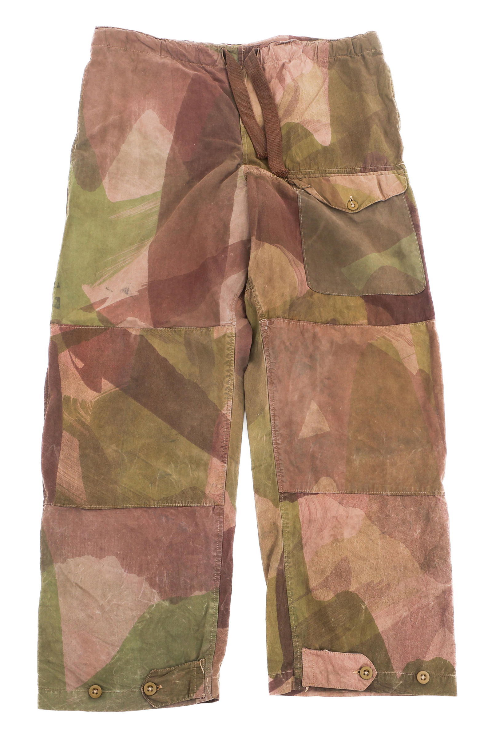WWII BRITISH PARATROOPER WINDPROOF TROUSERS: WWII BRITISH PARATROOPER WINDPROOF TROUSERS WWII British Paratrooper Windproof Camouflage Trousers. Windproof cotton construction. Brushstroke camouflage pattern with proof stamps present on the insid