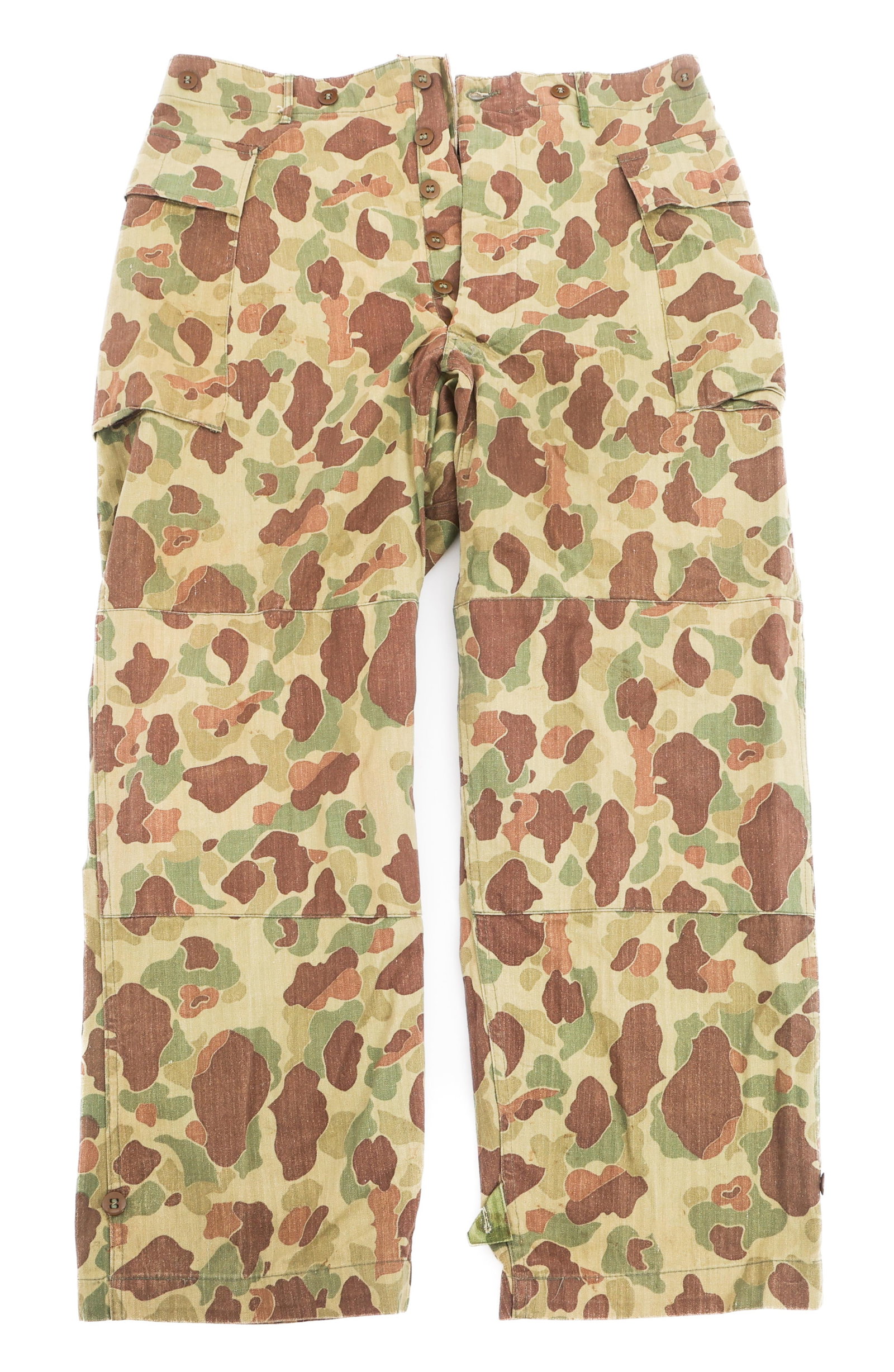 WWII US ARMY FROGSKIN CAMOUFLAGE HBT TROUSERS: WWII US ARMY FROGSKIN CAMOUFLAGE HBT TROUSERS WWII US Army Frogskin Camouflage Reversible HBT Trousers. Button up fly with gas flap, reinforced knee patches, and button ankle tabs. No visible maker ma