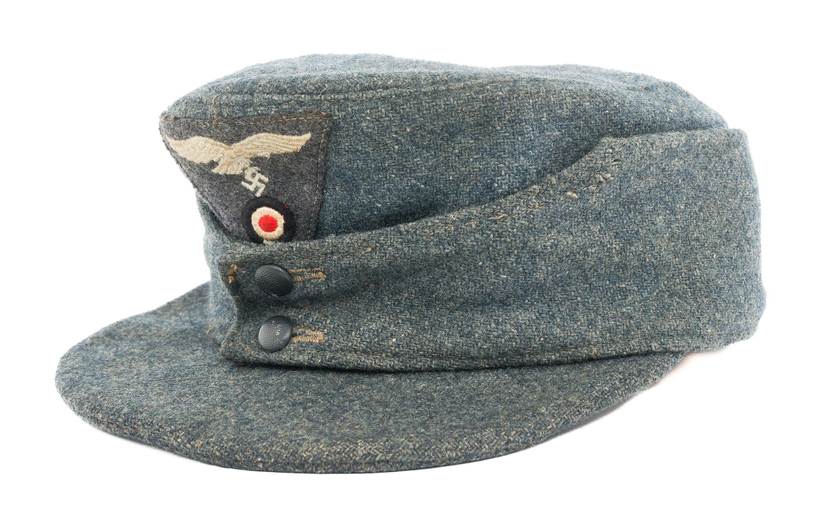 WWII GERMAN LUFTWAFFE EM/NCO M43 FIELD CAP: WWII GERMAN LUFTWAFFE EM/NCO M43 FIELD CAP WWII German Luftwaffe Enlisted/NCO M43 Field Cap. Blue-grey wool construction with embroidered Luftwaffe eagle and cockade cap badges. Faded maker mark and d