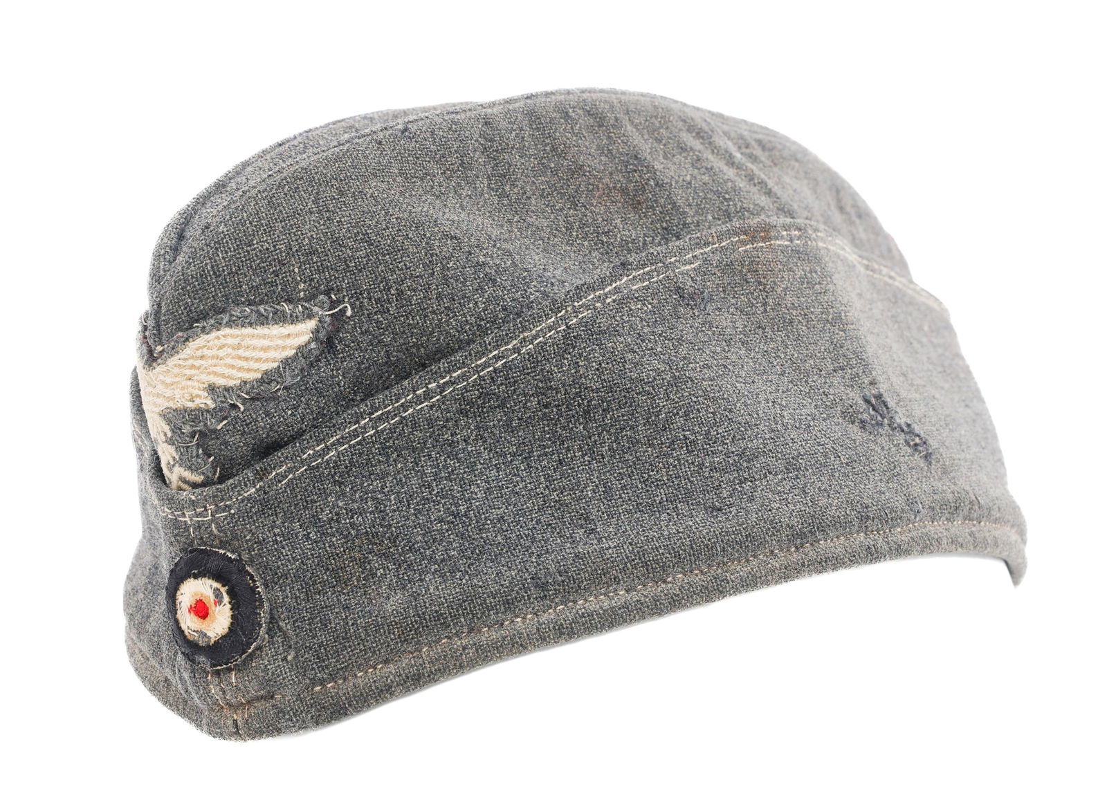 WWII GERMAN LUFTWAFFE ENLISTED OVERSEAS CAP: WWII GERMAN LUFTWAFFE ENLISTED OVERSEAS CAP WWII German Luftwaffe Enlisted Overseas Cap. Blue-gray wool construction with cloth eagle and cockade badges. No visible tags or stamps.