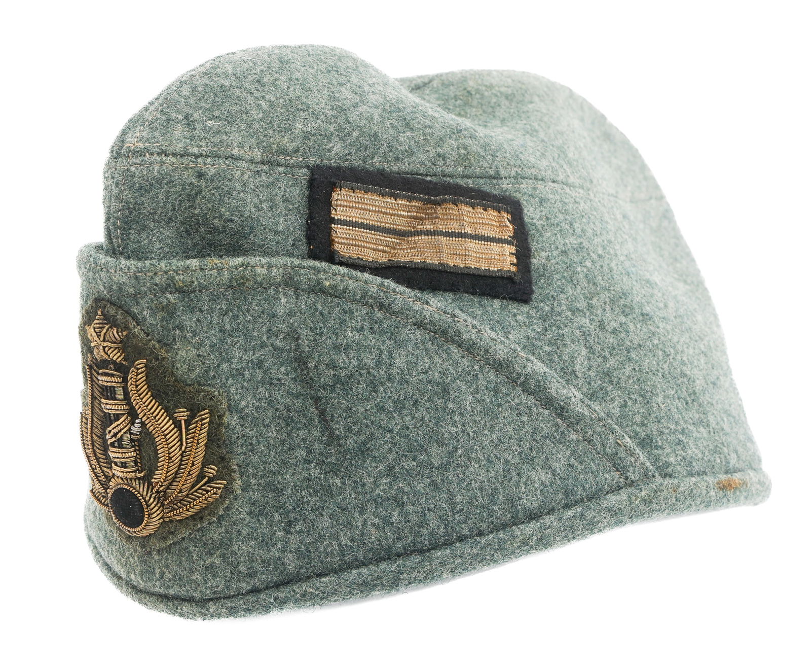 WWII ITALIAN MVSN OFFICER BUSTINA CAP: WWII ITALIAN MVSN OFFICER BUSTINA CAP WWII Fascist Italian MVSN Officer Bustina Cap. Grey wool construction with bullion MVSN badge and Capo Manipolo rank insignia. Leather sweatband and cloth lining.
