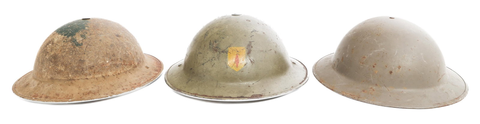 WWII - COLD WAR BRITISH ARMY MKII COMBAT HELMETS: WWII - COLD WAR BRITISH ARMY MKII COMBAT HELMETS WWII - Cold War British Army MkII Combat Helmets. Liners and chinstraps present. (2) WWII helmets, one with regimental insignia painted in front. (1) C