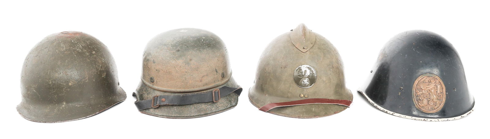 WWII - COLD WAR EUROPEAN MILITARY HELMETS: WWII - COLD WAR EUROPEAN MILITARY HELMETS WWII - Cold War European Military Helmets. (1) French M26. Frontal infantry badge. Leather chinstrap and liner. (1) Dutch M34. Repainted shell with House of O