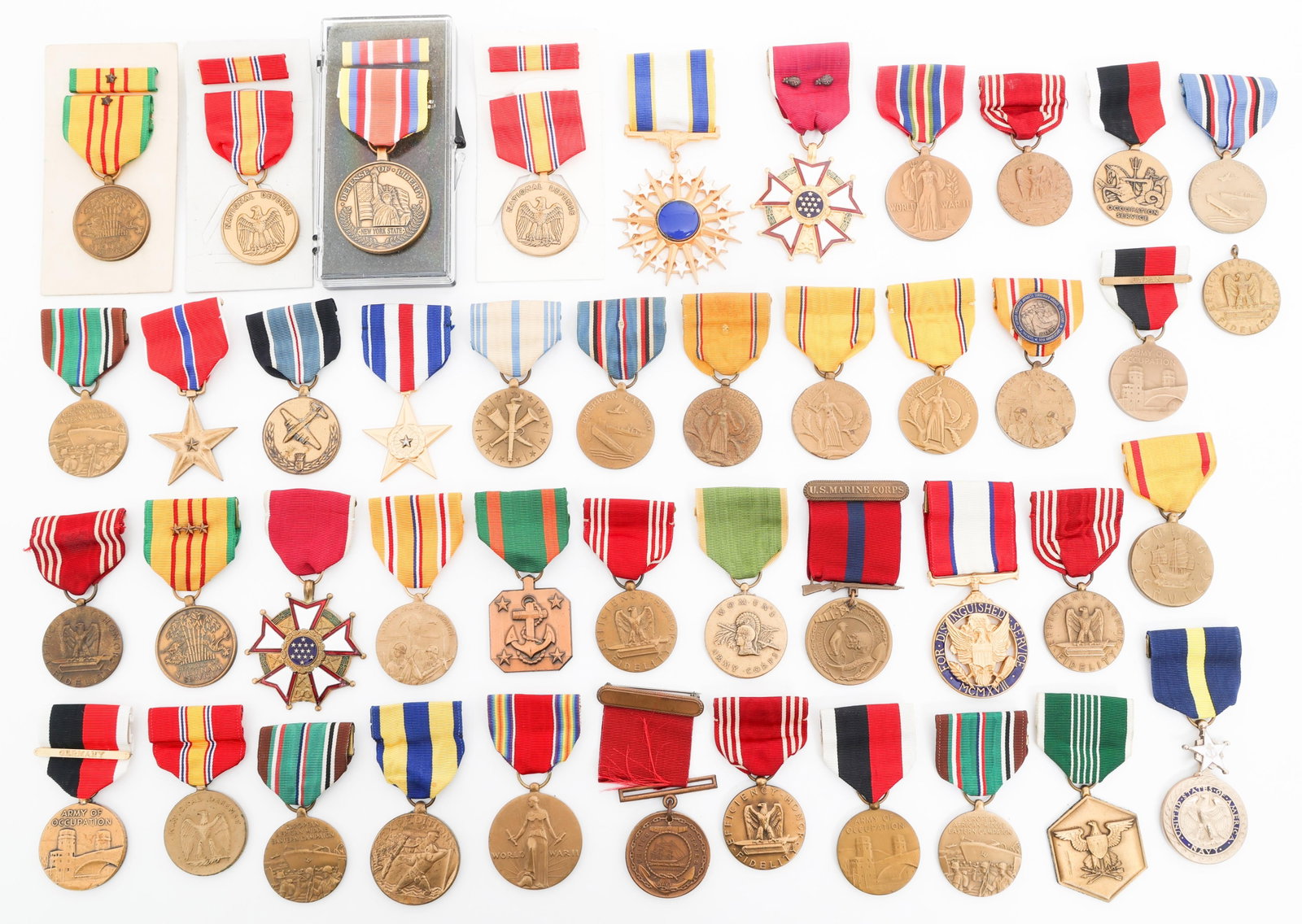 WWII - VIETNAM WAR US ARMED FORCES SERVICE MEDALS: WWII - VIETNAM WAR US ARMED FORCES SERVICE MEDALS WWII - Vietnam War US Armed Forces Service Medals. Includes Silver Star, Bronze Star, Legion Of Merit, Distinguished Service, USMC Good Conduct, Natio