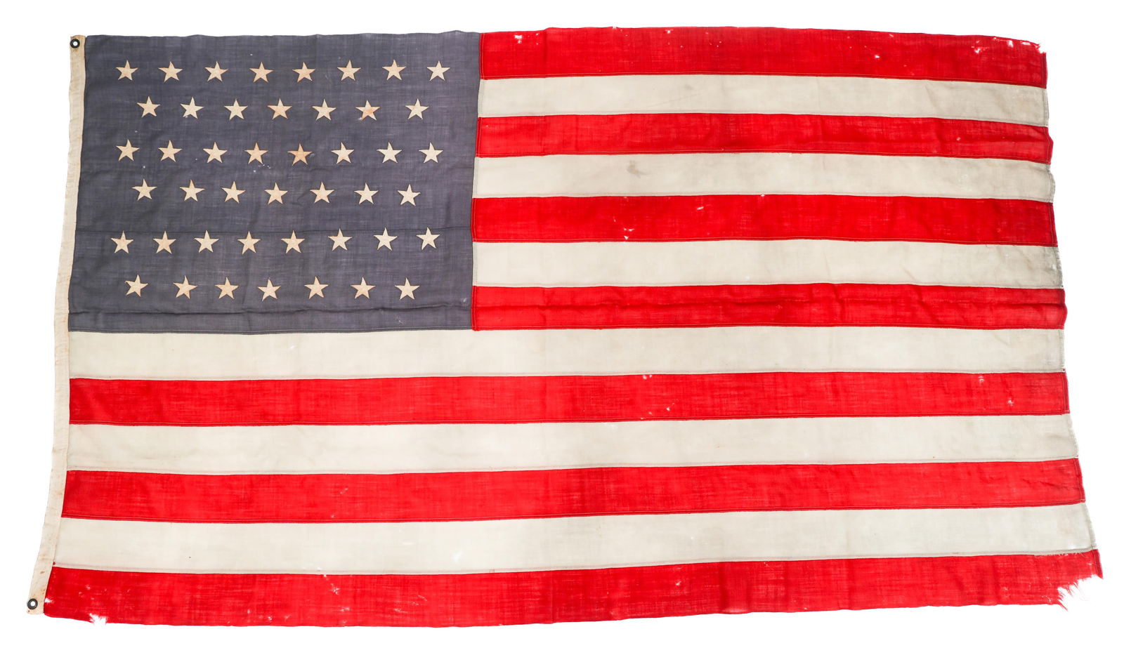 PRE-WWI 45 STAR AMERICAN FLAG: PRE-WWI 45 STAR AMERICAN FLAG Pre WWI 45 Star American Flag. Header with rivets present. Stamps and hand written characters present in the corner. Size: 49" x 84"