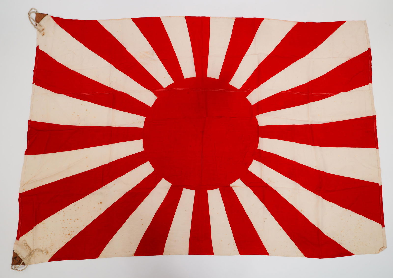 WWII IMPERIAL JAPANESE ARMY RISING SUN FLAG: WWII IMPERIAL JAPANESE ARMY RISING SUN FLAG WWII Imperial Japanese Army Rising Sun Flag. Double sided, single piece cotton construction with printed emblem. Leather reinforced corner tabs and rope. Si