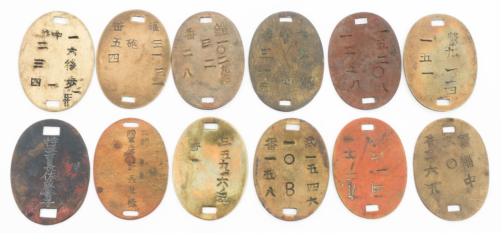 IMPERIAL JAPANESE ARMY DOG TAGS: IMPERIAL JAPANESE ARMY DOG TAGS Imperial Japanese Army Dog Tags. Brass and copper construction. Various Kanji stamps present.