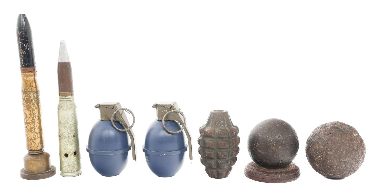 19th C. - COLD WAR WORLD MILITARY ORDNANCE: 19th C. - COLD WAR WORLD MILITARY ORDNANCE 19th C. - Cold War World Military Ordnance. (2) Iron Cannonballs. One is glued to wood base. (2) 20mm Shells. One is glued to wood base. (2) M26 Plastic Clas