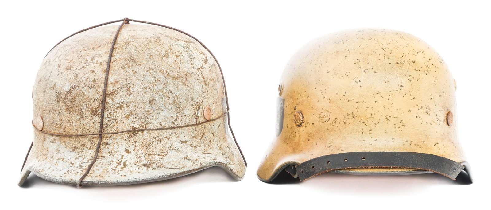 REFURBISHED WWII GERMAN ARMY WINTER COMBAT HELMETS: REFURBISHED WWII GERMAN ARMY WINTER COMBAT HELMETS Refurbished WWII German Army Winter Combat Helmets. (1) DD Winter M40 Combat Helmet. Heer and DAK side decals. Stamps present, faded. Leather liner a