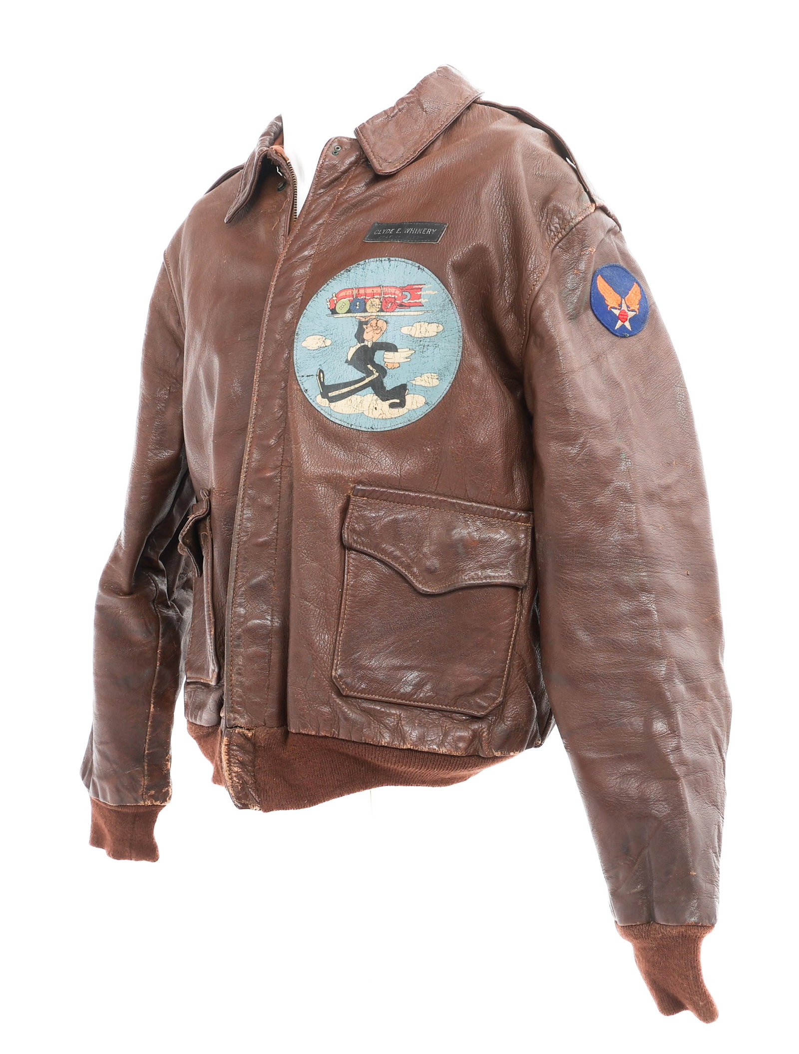WWII 20th AAF 357th BOMB SQUADRON A2 FLIGHT JACKET: WWII 20th AAF 357th BOMB SQUADRON A2 FLIGHT JACKET WWII US Army, 3rd Air Force, 357th Bomb Squadron, 302nd Bomb Group named A2 leather flight jacket. Leather name tag reads Clyde E. Whinery. Under the