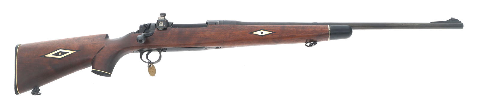 SPORTERIZED REMINGTON MODEL 1917 .30-06 RIFLE: SPORTERIZED REMINGTON MODEL 1917 .30-06 RIFLE Sporterized Remington Model 1917 .30-06 caliber bolt action rifle. Flaming bomb and eagle head stamps on barrel and receiver. Blade front sight. Redfield
