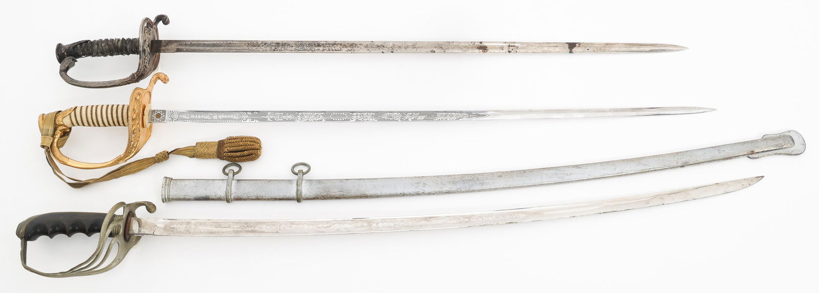 INDIAN WARS - WWII US M1852 & M1902 SWORDS: INDIAN WARS - WWII US M1852 & M1902 SWORDS Indian Wars - WWII US M1852 and M1902 Swords. (1) M1902 Sword. Maker marked by MC Lilley on the ricasso. Steel scabbard. (1) Modern M1852 Officer Sword. Trip