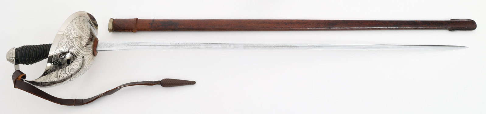COLD WAR BRITISH M1912 CAVALRY OFFICER SWORD: COLD WAR BRITISH M1912 CAVALRY OFFICER SWORD Cold War British M1912 Cavalry Officer Sword. Single edged, bright blade with fuller. Double acid etched with floral and patriotic patterns. Maker marked b