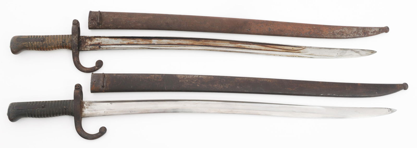 FRENCH M1866 CHASSEPOT BAYONETS WITH SCABBARDS: FRENCH M1866 CHASSEPOT BAYONETS WITH SCABBARDS French M1866 Chassepot Bayonets with Scabbards. (1) M1866 Yataghan Bayonet. Single edged, yataghan blade with fuller. Marked by St. Etienne and dated 187