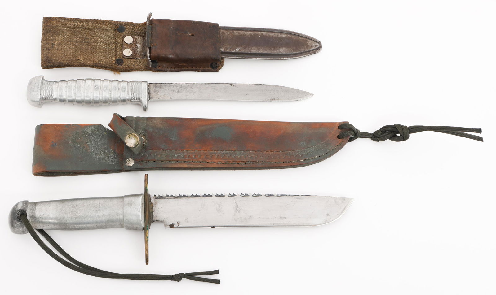WWII US ARMED FORCES ALUMINUM HANDLE KNIVES: WWII US ARMED FORCES ALUMINUM HANDLE KNIVES WWII US Armed Forces Aluminum Handle Knives with Sheaths. (1) Custom Knife. Single edged, straight bright sawback blade. Alloy and brass hilt. Leather sheat