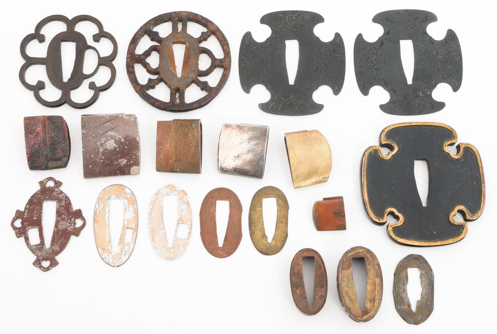 JAPANESE HABAKI, TSUBA, FUSCHI & SEPPA PARTS: JAPANESE HABAKI, TSUBA, FUSCHI & SEPPA PARTS Japanese Katana Parts. Brass, iron and copper construction. (5) Habaki. (3) Tsuba. (2) Fuchi. (6) Seppa. Provenance: .
