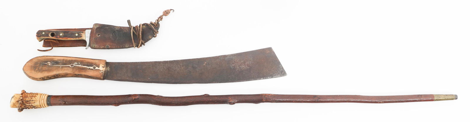 PUMA SKINNER KNIFE, MACHETE, & CANE: PUMA SKINNER KNIFE, MACHETE, & CANE Puma Skinner Knife, Machete, and Cane. (1) Puma Skinner. Single edged blade. Maker marked by Puma near the spine. Alloy hilt with stag horn handles. Leather sheath