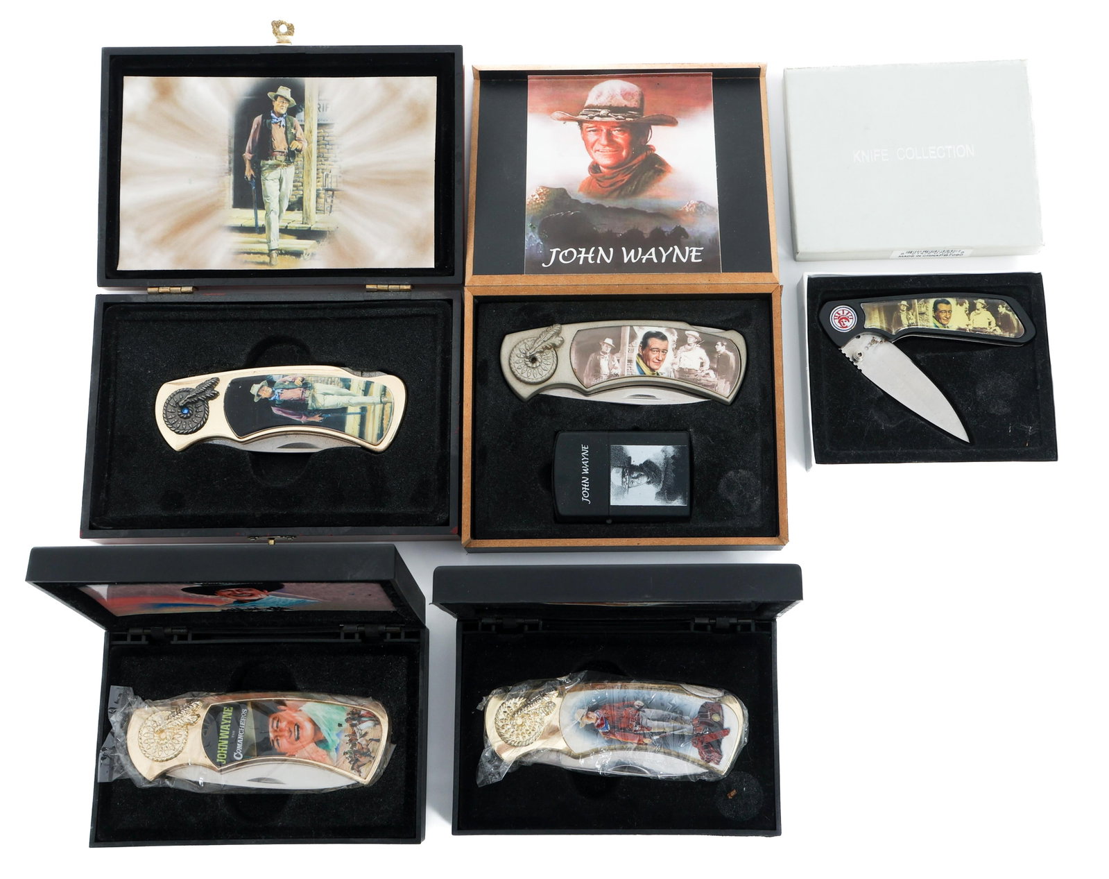 JOHN WAYNE THEMED COLLECTOR KNIVES & BOXES: JOHN WAYNE THEMED COLLECTOR KNIVES & BOXES John Wayne Themed Collector Folding Pocket Knives and Boxes. Various styles. Includes wooden display boxes. Made in China. Blade Length: 2 1/2" to 3" Total L