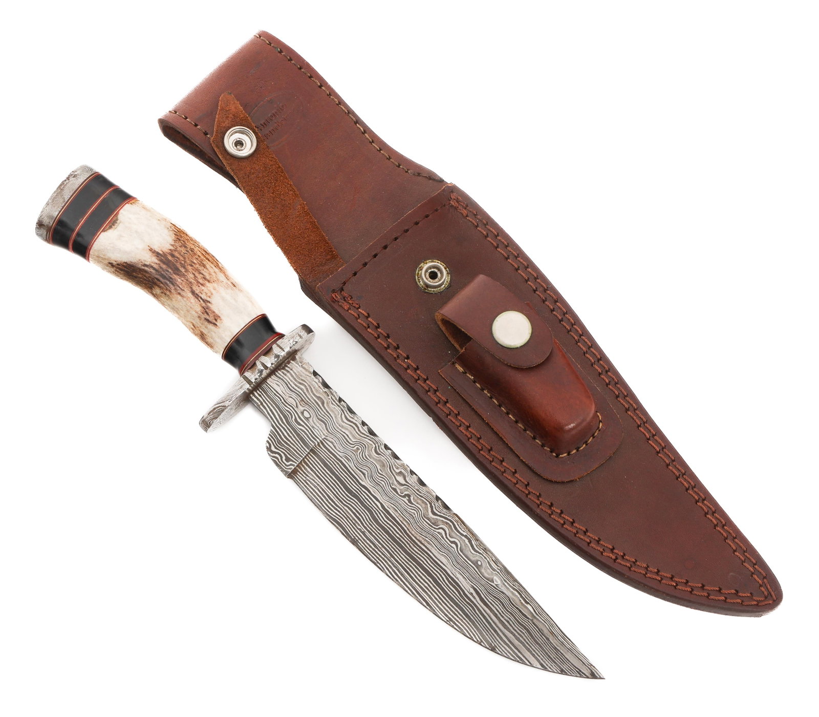 CUSTOM MADE DAMASCUS KNIFE by ANTONIO BANDERAS: CUSTOM MADE DAMASCUS KNIFE by ANTONIO BANDERAS Custom Made Damascus Knife. Single edged, Damascus blade. Maker marked by Antonio Banderas near the ricasso. Damascus steel hilt with stag horn handle. B