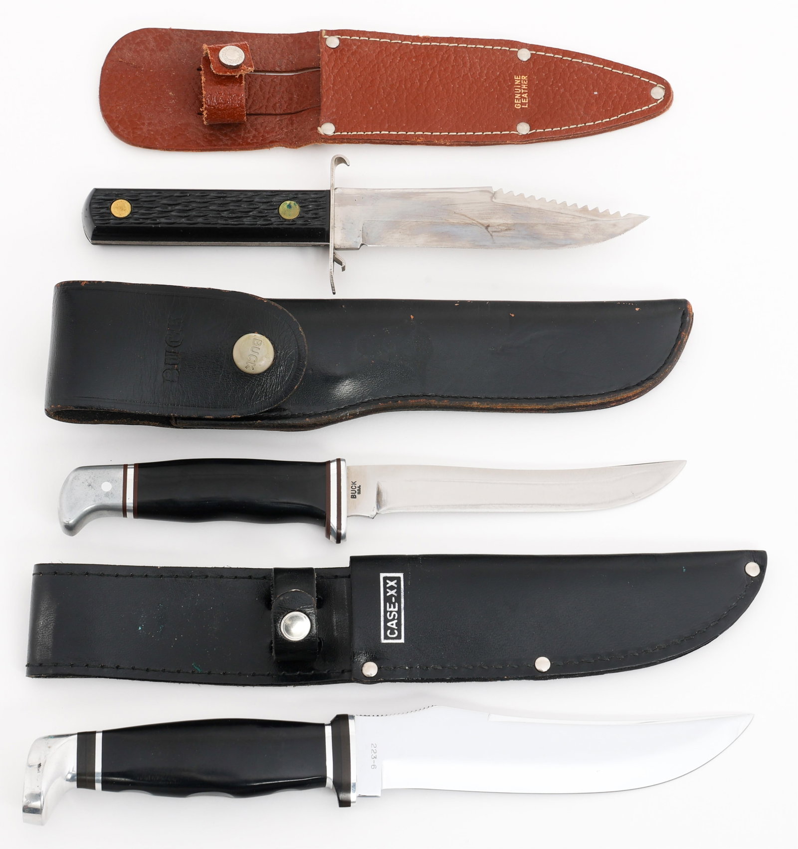 BUCK, CASE & COLONIAL FIXED BLADE KNIVES: BUCK, CASE & COLONIAL FIXED BLADE KNIVES Fixed Blade Knives. (1) Buck Knife. Single edged, bright blade. Maker marked by Buck on the ricasso. Composite handle with alloy based pommel. Leather sheath. 